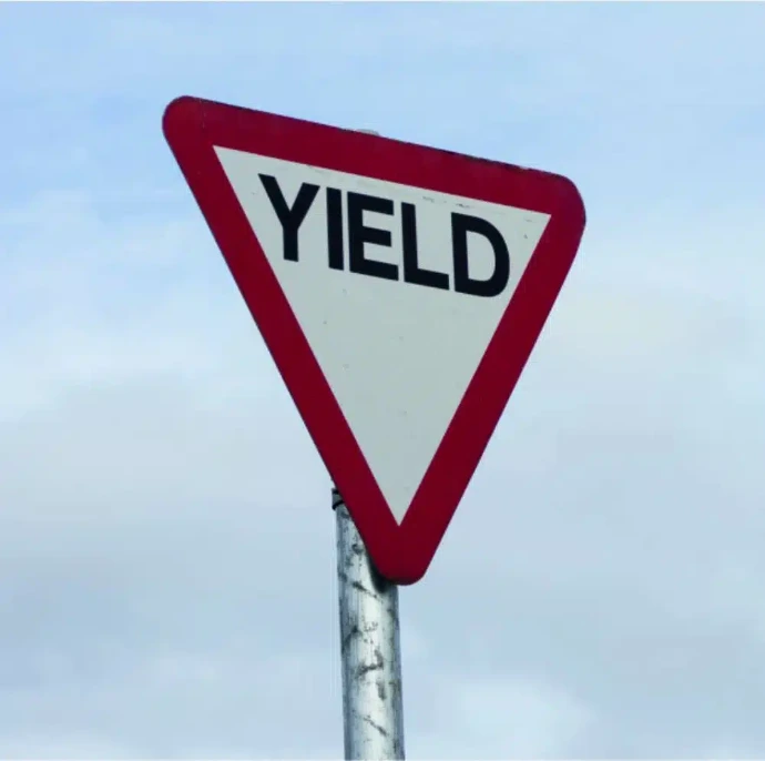 Reflective pole-mounted yield sign