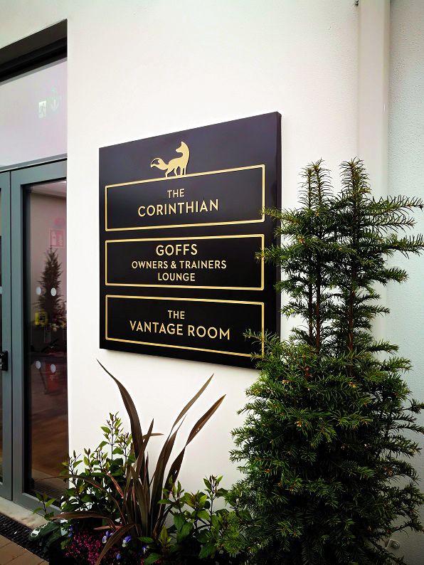 External wall-mounted sign