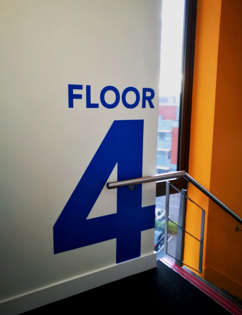 Vinyl wall graphics in stairwell with floor number