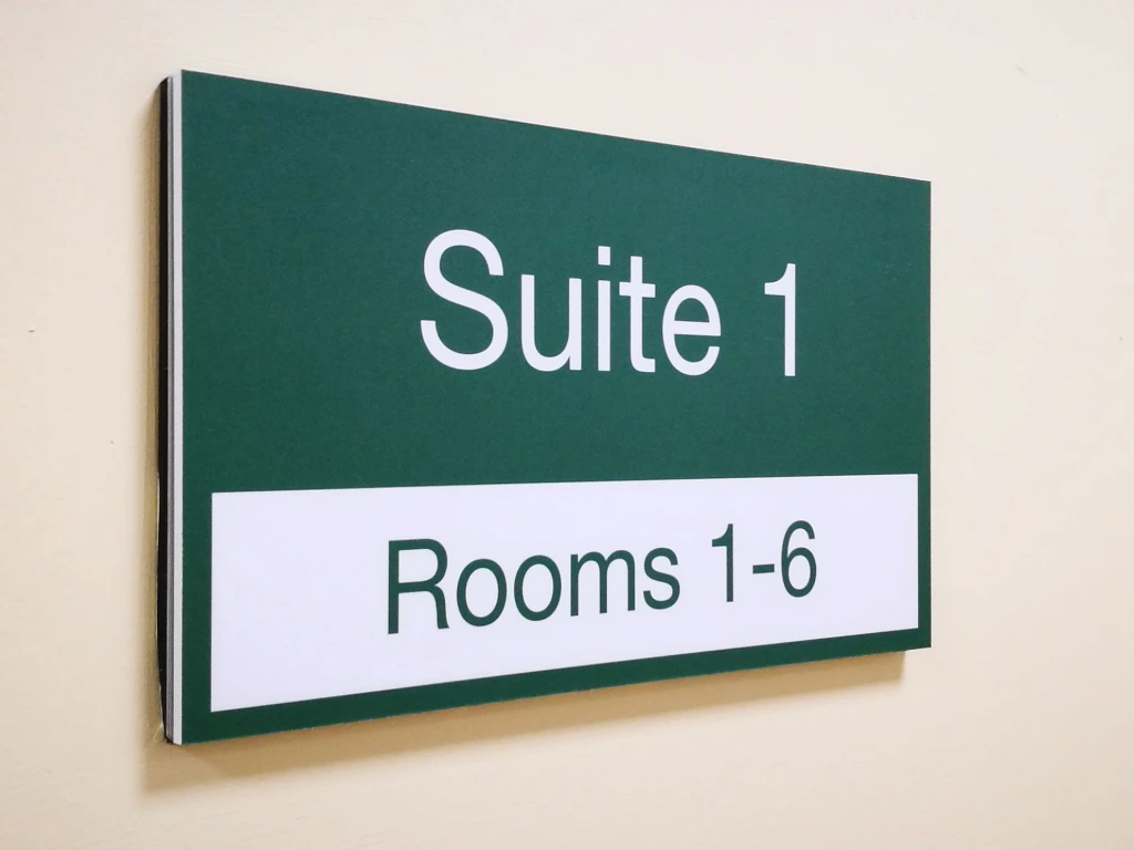 Wall-mounted room sign